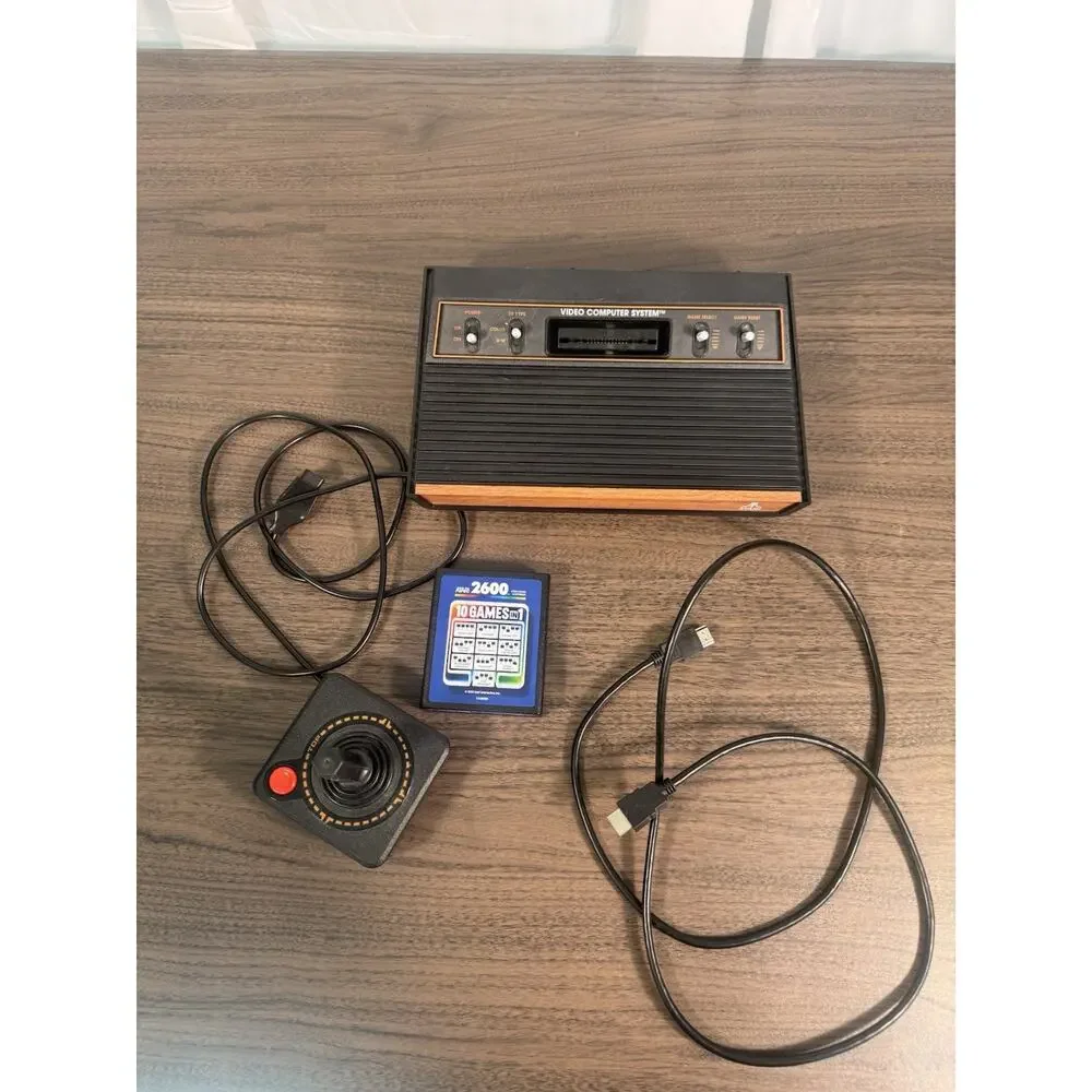 atari 2600 console with joystick, cables and‎ one cartridge with 10 game working